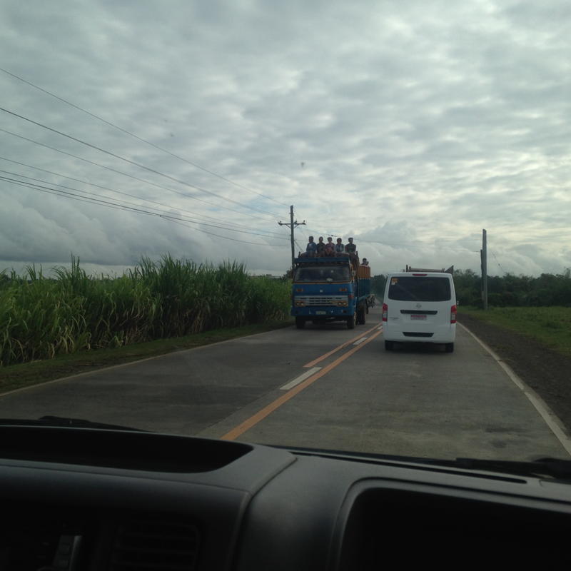 Farmers riding on top of a truck. Iāve seen people riding on the hoods of some of these trucks before.